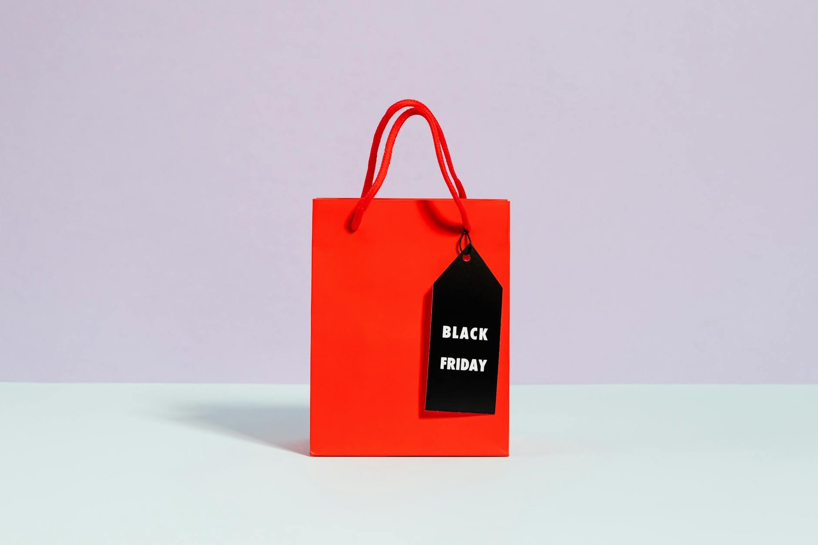 Vibrant red shopping bag with a Black Friday tag, perfect for sale promotions.