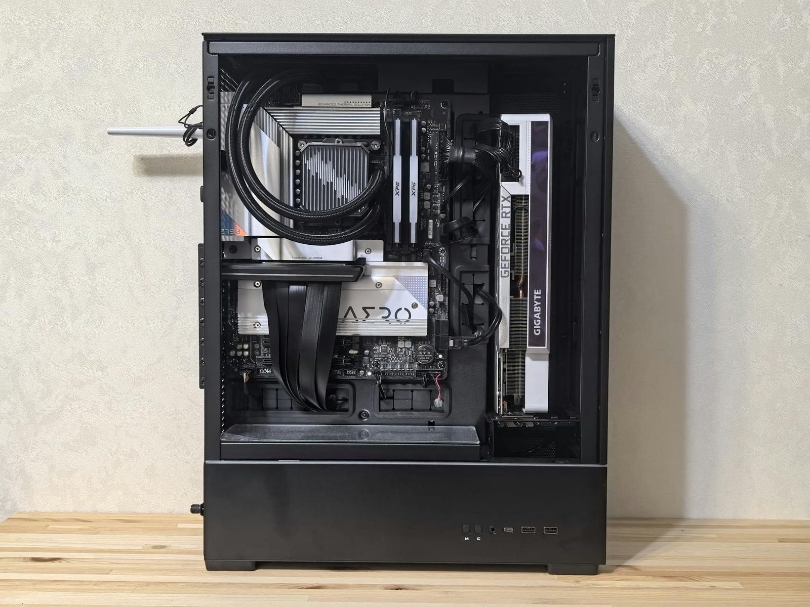 Interior view of a custom-built gaming PC showing components like GPU and cooling system.