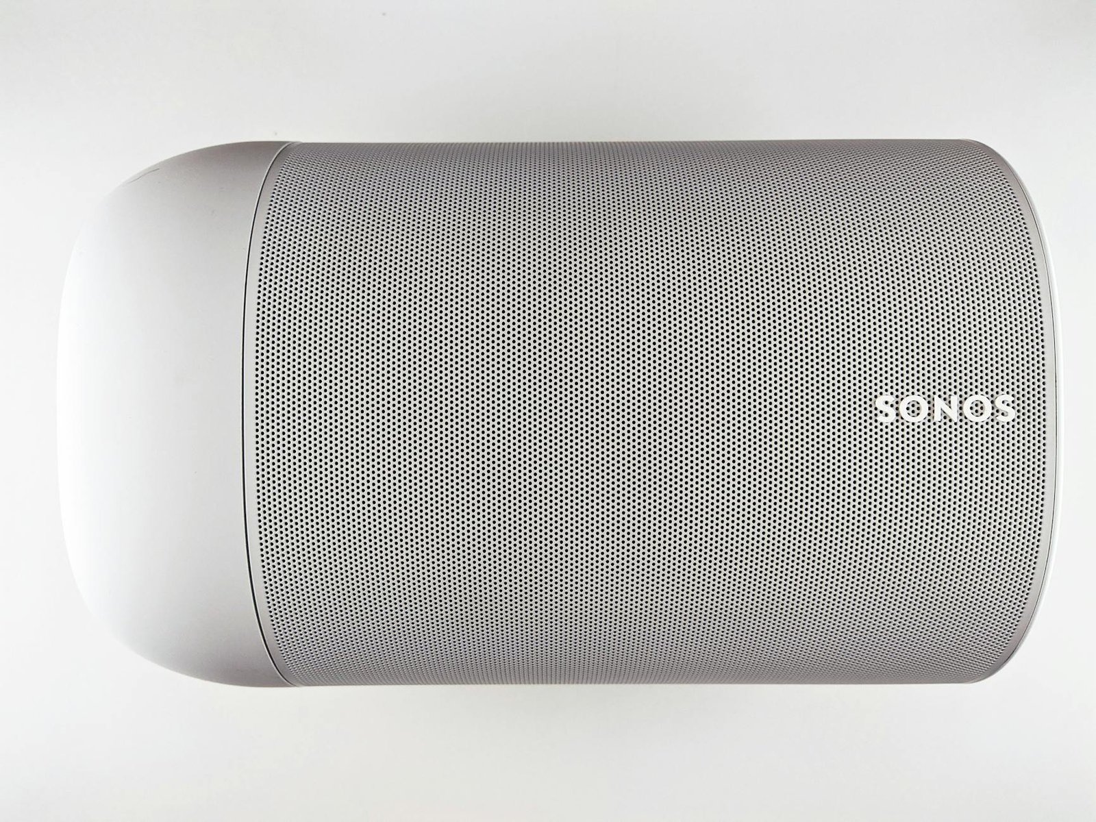 Top view of a sleek wireless speaker with a minimalistic design.