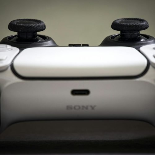Detailed view of a Sony PlayStation 5 DualSense controller, highlighting design and features.