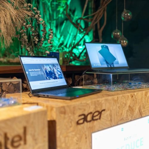 Showcasing Acer laptops with Intel processors at a contemporary tech event.