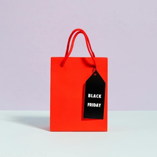 Vibrant red shopping bag with a Black Friday tag, perfect for sale promotions.