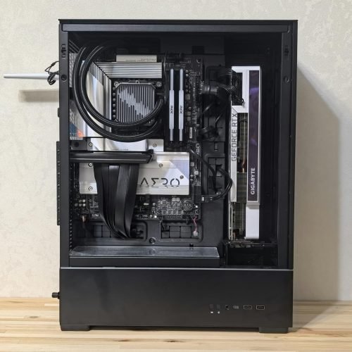 Interior view of a custom-built gaming PC showing components like GPU and cooling system.