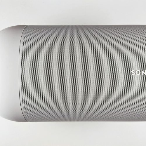 Top view of a sleek wireless speaker with a minimalistic design.